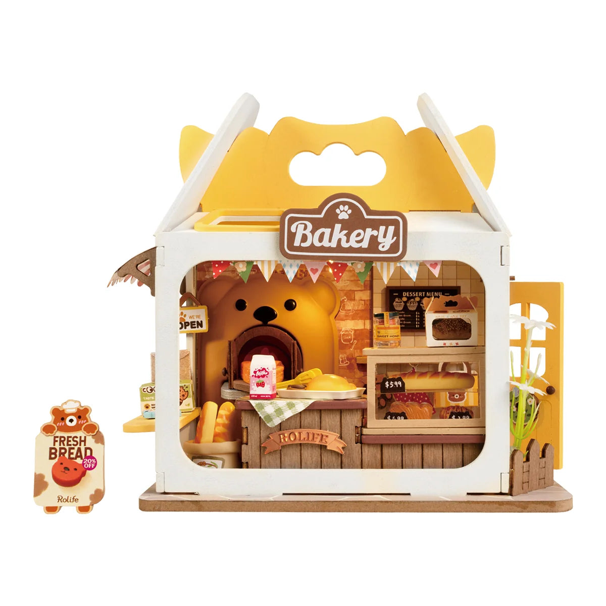 Miniature bakery house display with 'Bakery' sign, open front window and shelves