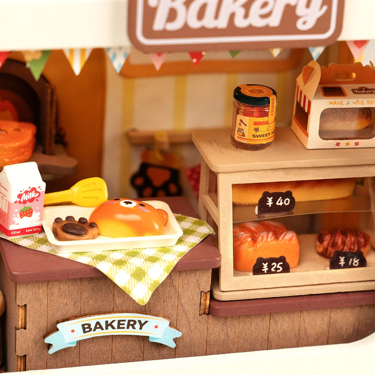 Miniature bakery shop interior with shelves, pastries, and price-tag decorations