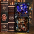 Miniature book nook insert kit with decorative frame and tiny books inside