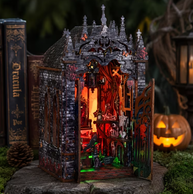 Miniature gothic castle book nook insert with open doorway and detailed shelves