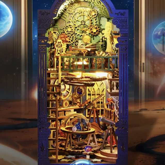 Miniature DIY book nook insert with golden mechanical shelves and gears, blue frame