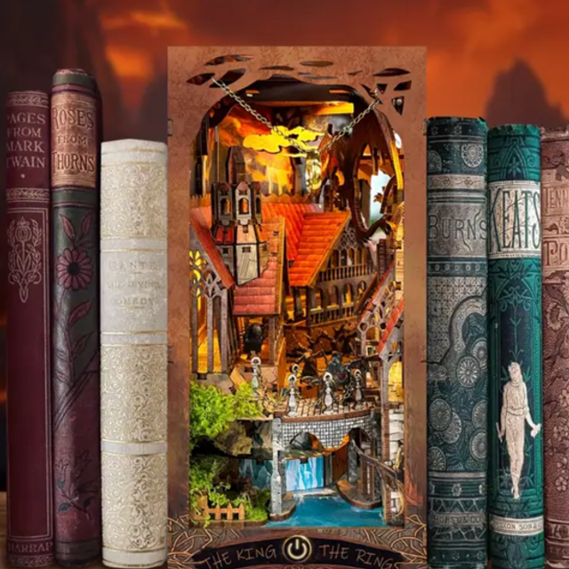 Miniature book nook insert with ornate arched interior scene and figurines