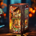 Miniature wooden book nook kit insert with autumn cottage scene inside