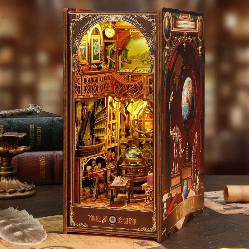 Miniature bookshelf insert kit with open front showing ornate gold room scene and books