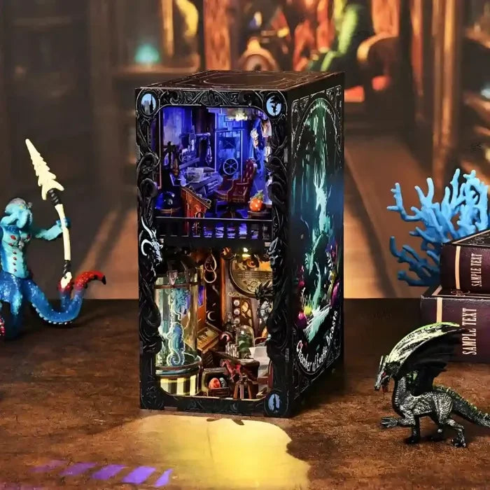 Miniature book nook insert box featuring a beast-themed shelf diorama and creatures