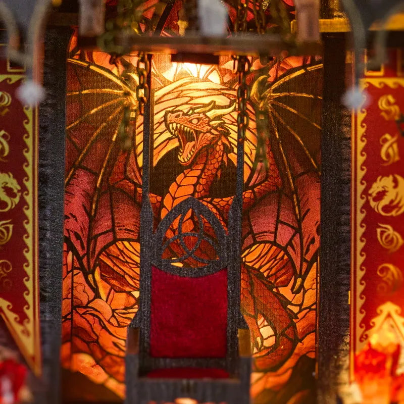 Book nook insert panel with dragon artwork behind dark lattice frame