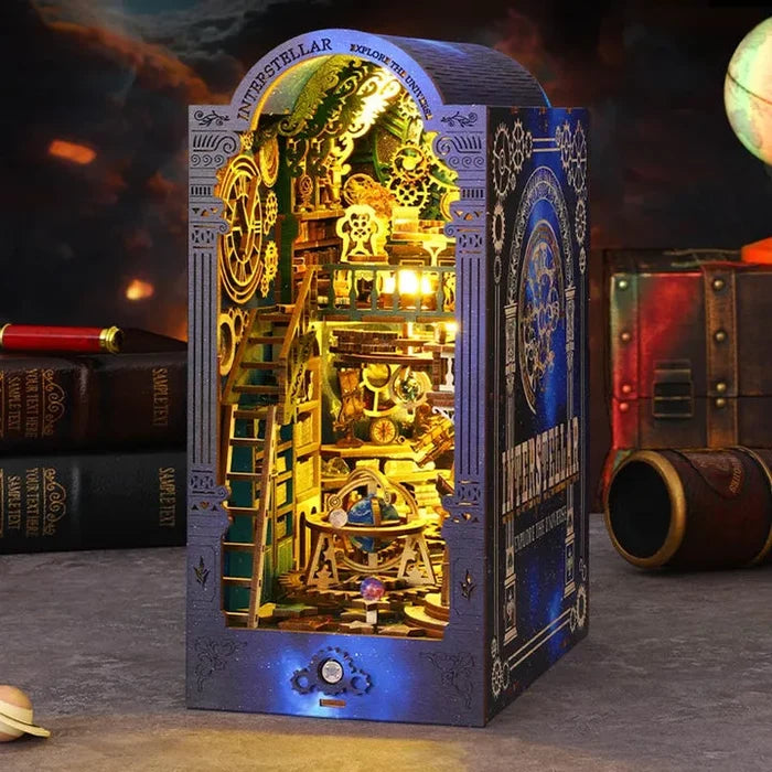 Steampunk observatory book nook insert with glowing golden miniature scene