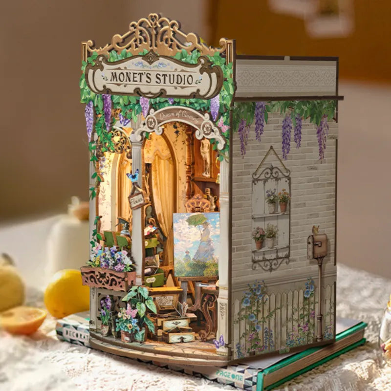 DIY miniature book nook insert shaped like Monet's Studio building with open interior