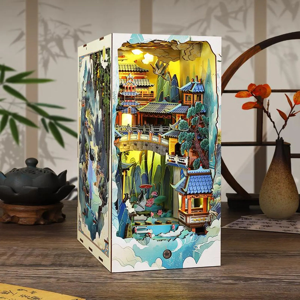 DIY miniature book nook kit with boxed scene insert, colorful fantasy shelves inside