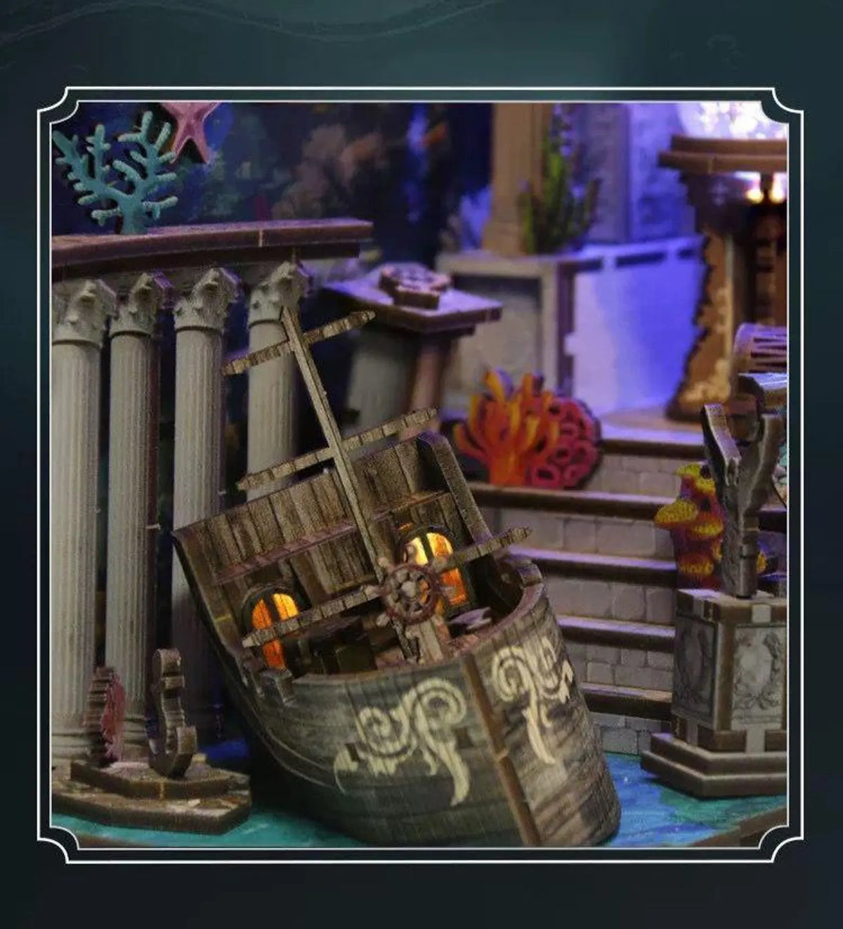 Miniature underwater book nook insert with curved ship-like display and tiny props