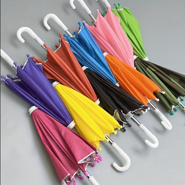 Miniature umbrellas assorted colors with white curved handles and ball tips