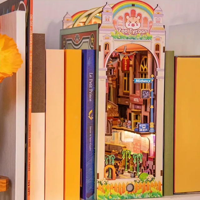 Miniature bookshelf insert kit with arched colorful storefront scene inside