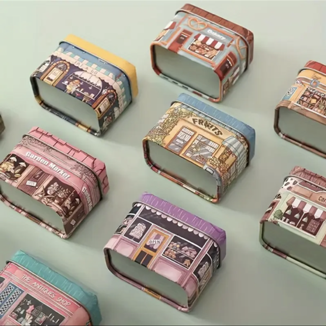 Mini decorative storage tins with hinged lids and house-print artwork