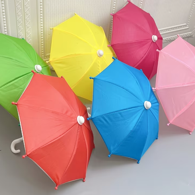 Set of miniature umbrellas in bright colors, each with round ball tips