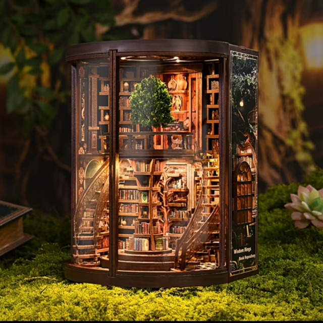 Miniature wooden ring bookshelf insert with illuminated shelves and central tree decor.