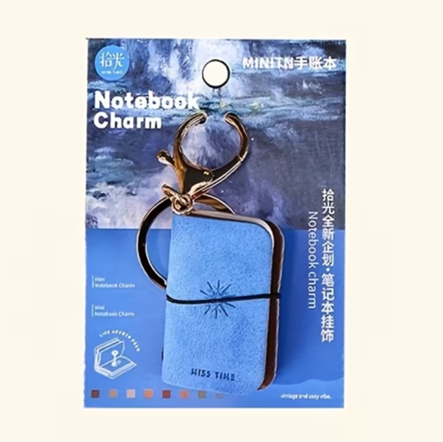 Blue mini notebook keychain charm with gold keyring and clasp, printed cover