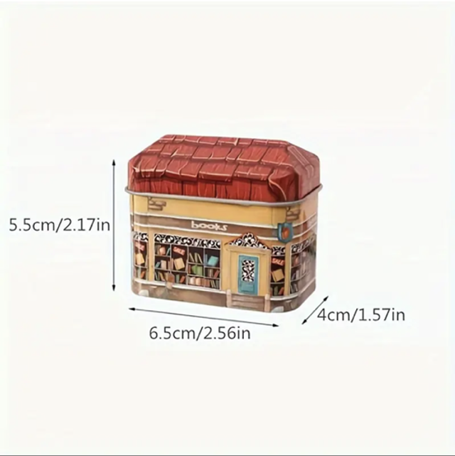 Mini storage tin with house pattern lid; size 6.5 x 4 x 5.5 cm