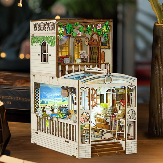 Miniature book nook DIY insert with two-story dollhouse interior, railing, stairs, plants