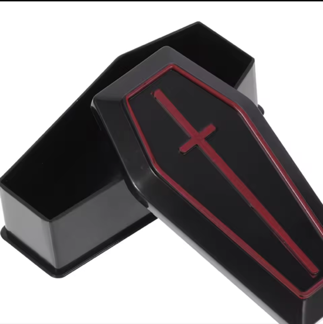 Mini coffin storage box, open black case with red-trim lid and red cross emblem
