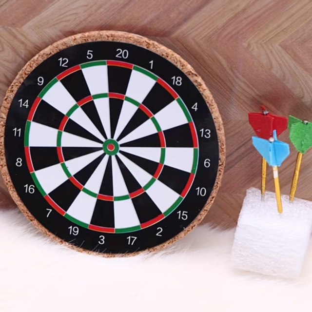 Mini dartboard with numbered target rings and three plastic darts