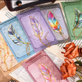 Metal feather bookmark with iridescent pastel colors and gold chain