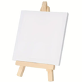 Mini easel with blank white canvas on small wooden tripod legs