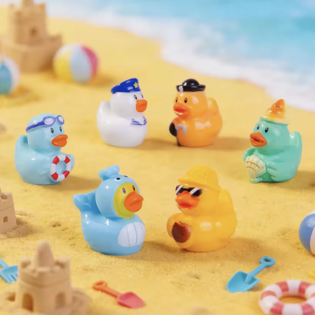 Mini rubber duck figurines set: blue, orange, green, and white beach ducks
