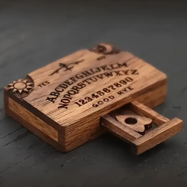Mini wooden Ouija board with engraved letters and storage compartment, lid open