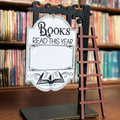 Books Read This Year mini sign with black stand and white book-shaped plaque