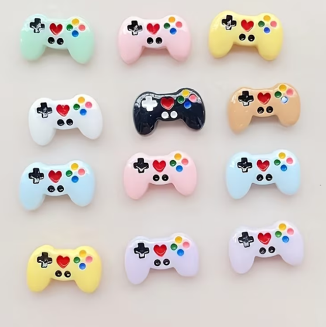 Set of mini kawaii gaming controllers in pastel colors, with colorful button icons
