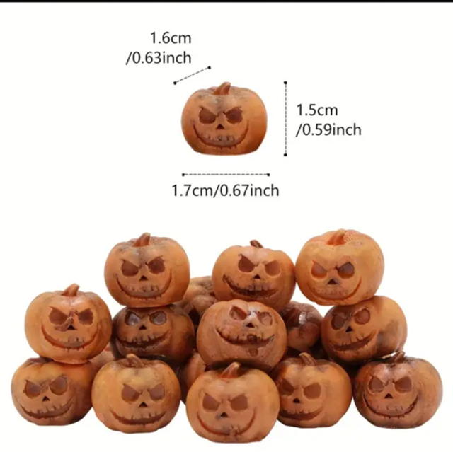 Mini resin jack-o'-lantern figurines with carved smiling pumpkin faces