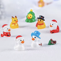 Mini Christmas duck figurine set with 7 ducks wearing hats and winter outfits