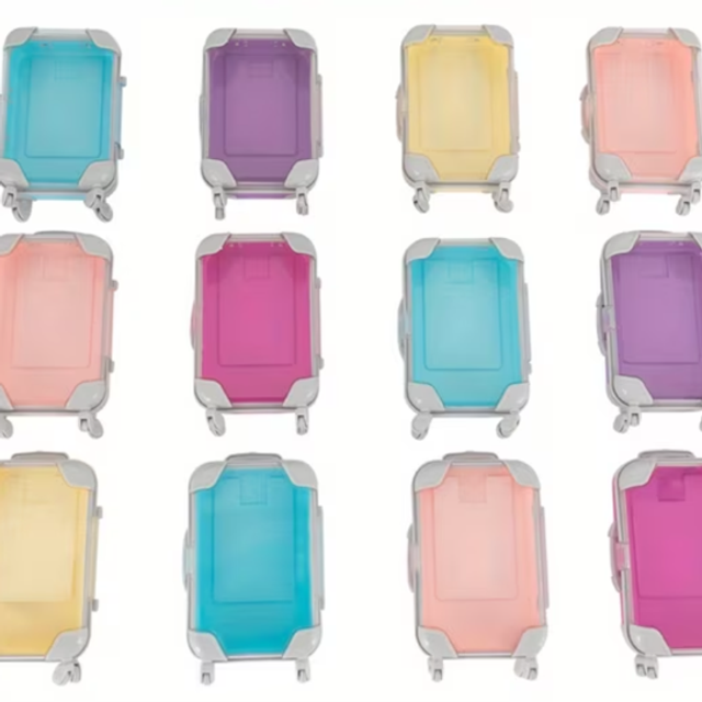 Mini rolling storage container with hard shell and wheels, shown in assorted colors