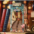 Miniature bookshelf insert kit with miniature street scene diorama and books