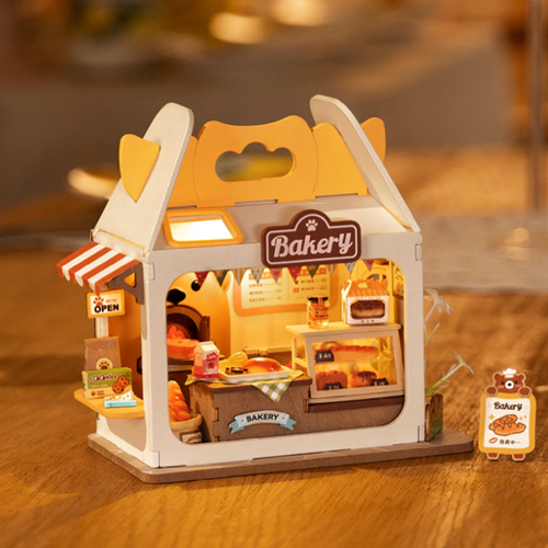 Miniature bakery breadbox DIY kit with open front, shelves, and Bakery logo sign