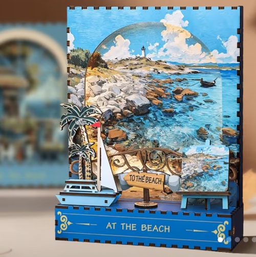 DIY miniature beach scene kit with ocean, rocks, sailboat, and 'To the Beach' sign