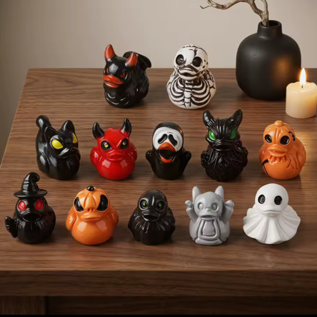 Set of small Halloween duck figurines, black, orange, red, and white faces