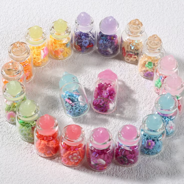 Mini glass bottle pendants with assorted pastel contents, shown as a circular display
