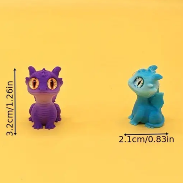 Mini dragon figurines, purple and blue, with large round eyes and small wings