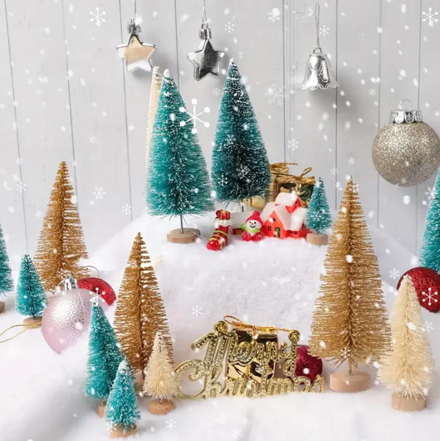 Mini artificial Christmas trees with glitter foliage and star topper, displayed with ornaments