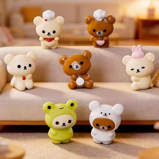 Mixed kawaii mini bear figures, small resin-like collectibles with raised arms and faces.