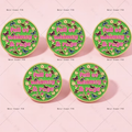 Round enamel pin badge with green background and colorful "Full of whimsy & rage" text.
