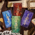 Ornate fantasy sword bookmark, gold sword on teal card among four color variants