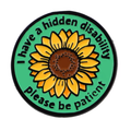 Round green hidden disability pin badge with sunflower and message, black border