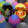 Mini dragon egg figurines with cute faces in bright multicolor shells