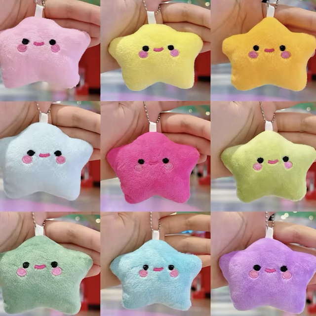 Plush star keychain with smiling face, round eyes and pink cheeks