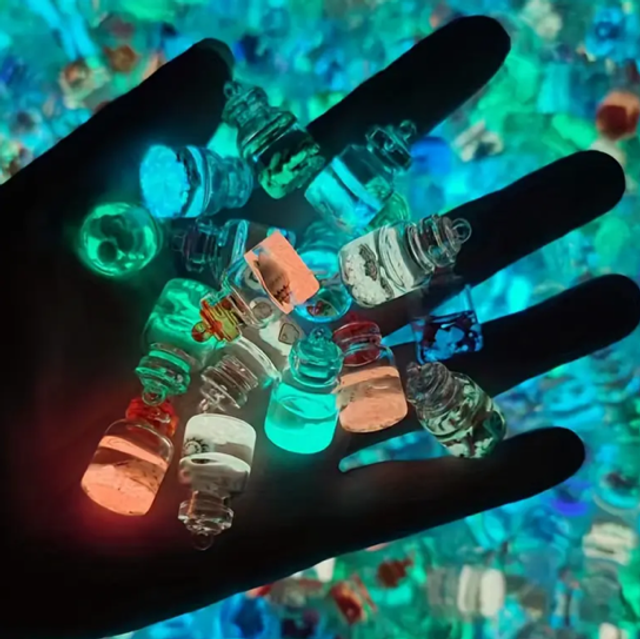 Mini glow bottle set of small glass bottles with dark caps and colorful contents
