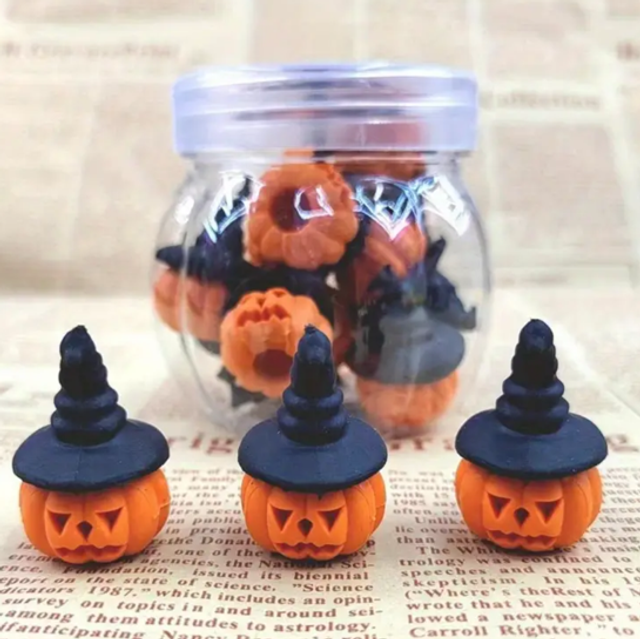 Mini pumpkin hats: three orange pumpkin faces with black pointed tops